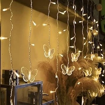 ریسه پرده آویز پروانه ای.طول ریسه 3متر دارای 20آویز خوشه ای با پروانه